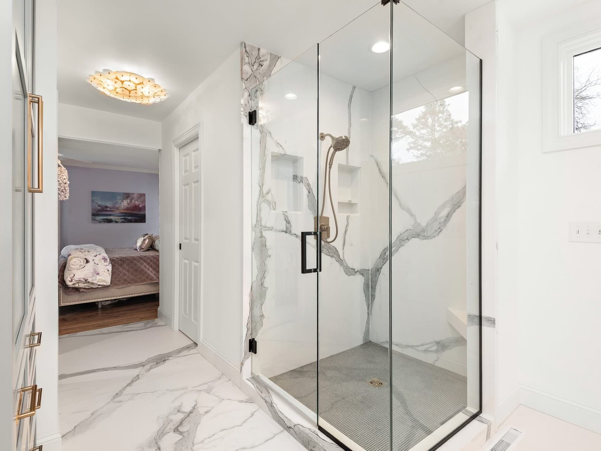 Luxurious bathroom renovation with marble-look porcelain walls and premium finishes